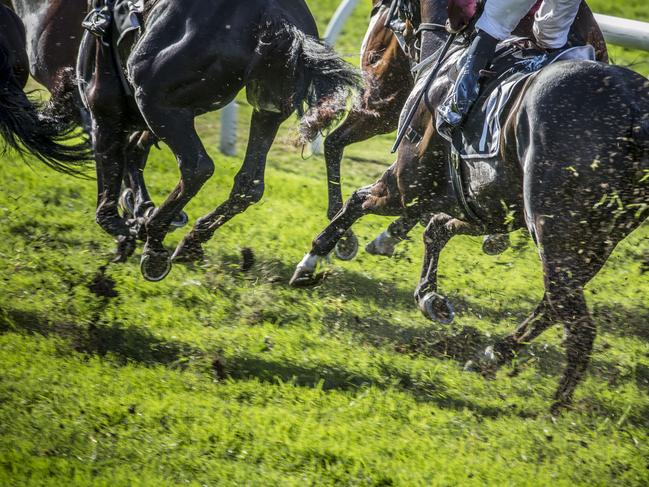 Excessive turf kickback occuring on the track during the Darley Kingsford Smith Cup Day, formerly BTC Cup Day, at Eagle Farm Racecourse in Brisbane, Saturday, May 27, 2017. (AAP Image/Glenn Hunt) NO ARCHIVING, EDITORIAL USE ONLY