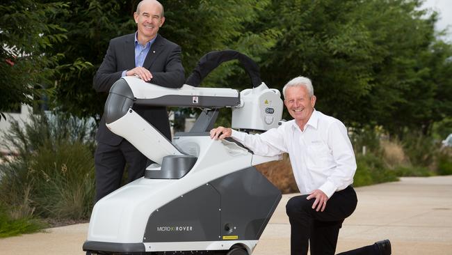 Saab Australia managing director Andy Keough with Micro-X managing director Peter Rowland with the Rover. Picture supplied