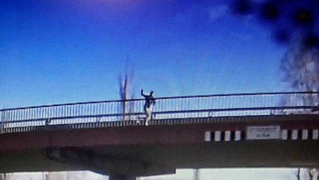 A man allegedly throwing rocks off a Dubbo bridge. Picture: Supplied