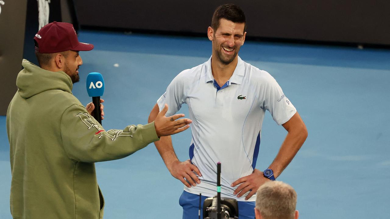 Kyrgios, seen here interviewing Novak Djokovic, has been undertaking more off-court pursuits. (Photo by David GRAY / AFP)