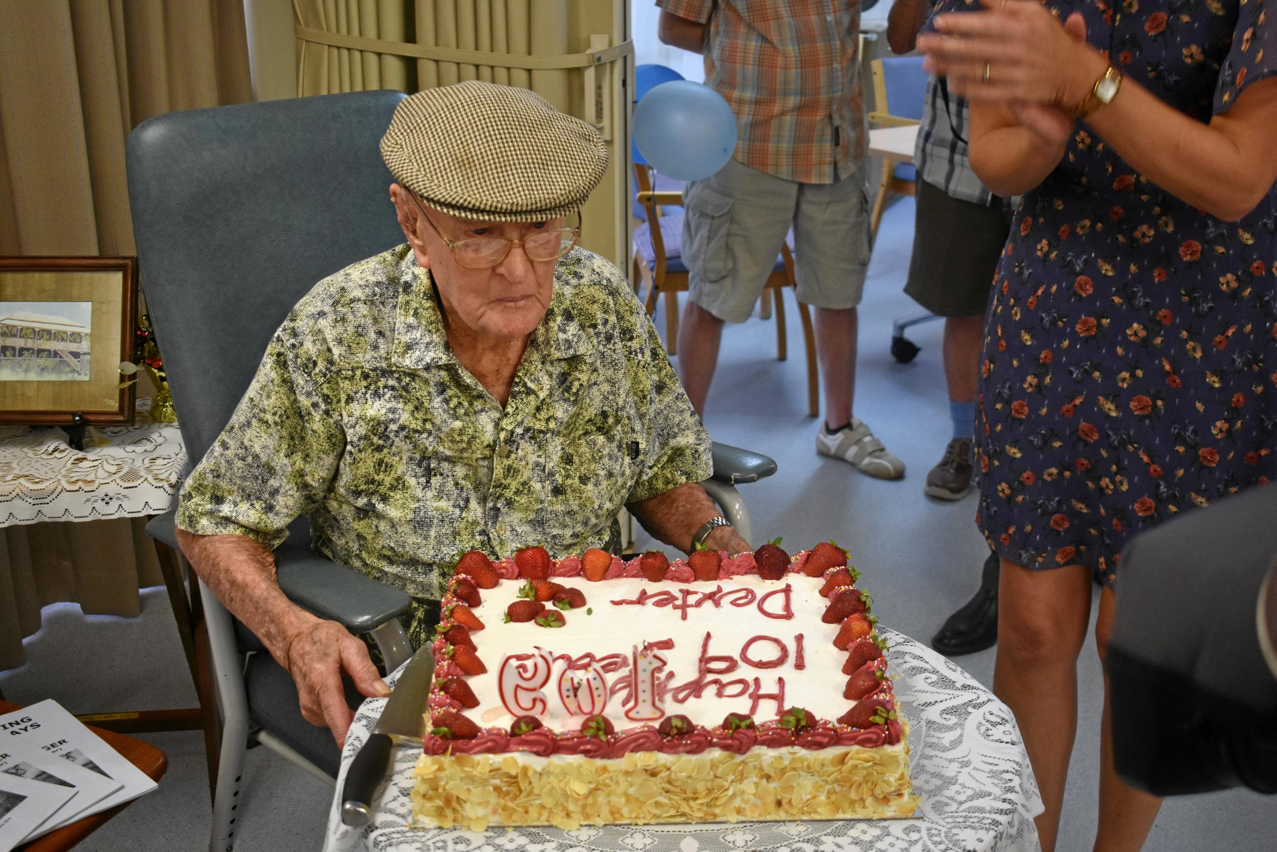 DExter Kruger blows out the candles on his 109th birthday cake. Picture: Jorja McDonnell