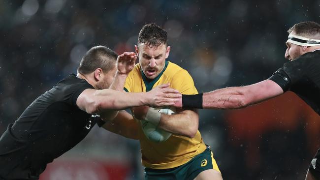 AUCKLAND, NEW ZEALAND - AUGUST 17: Nic White of the Wallabies is tackled during The Rugby Championship and Bledisloe Cup Test match between the New Zealand All Blacks and the Australian Wallabies at Eden Park on August 17, 2019 in Auckland, New Zealand. (Photo by Hannah Peters/Getty Images)