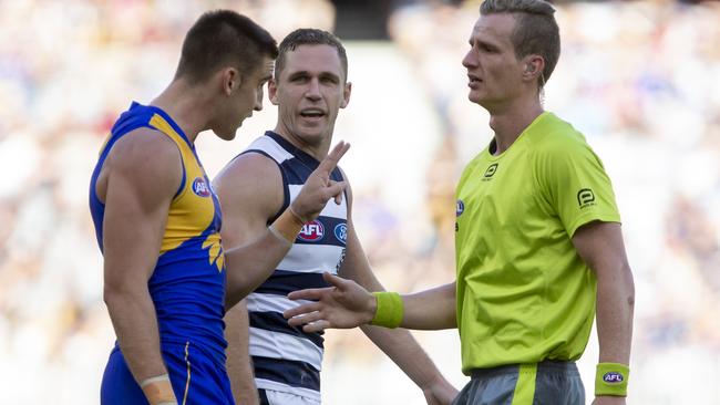 West Coast's Elliot Yeo remonstrates with the umpire as Geelong captain Scott Selwood looks on during the Round 3 AFL match between the West Coast Eagles and the Geelong Cats at Optus Stadium in Perth, Sunday, April 8, 2018. (AAP Image/Travis Anderson) NO ARCHIVING, EDITORIAL USE ONLY