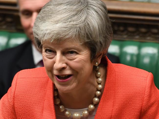 Britain's Prime Minister Theresa May speaks to lawmakers in parliament, London, Wednesday Feb. 27, 2019.  May insisted Wednesday that Britain will leave the European Union on schedule next month, amid signs that her promise to give Parliament a vote on delaying Brexit was boosting support for her unpopular EU divorce deal. (Jessica Taylor/UK Parliament via AP)