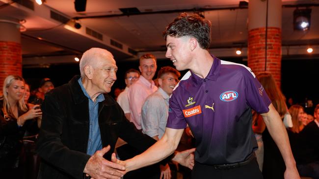 St Kilda draftee Darcy Wilson is congratulated by grandfather Chas Wilson on Monday night. Picture: Dylan Burns