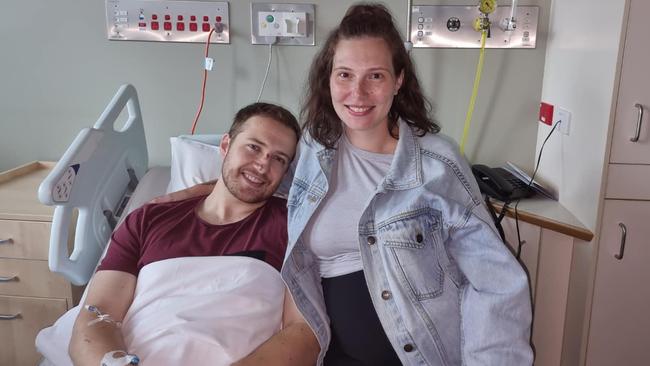 Constable Randall Kirk was shot during the ambush at Wieambilla in December 2022. Pictured recovering in hospital with his wife, Breanna. Picture: Facebook