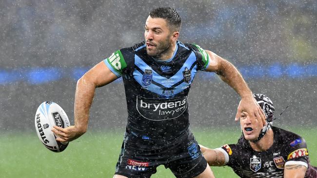 James Tedesco (left) of the Blues gets past Kalyn Ponga (right) of the Maroons during Game 2 of the 2019 State of Origin series between the Queensland Maroons and the New South Wales Blues at Optus Stadium in Perth, Sunday, June 23, 2019. (AAP Image/Darren England) NO ARCHIVING, EDITORIAL USE ONLY