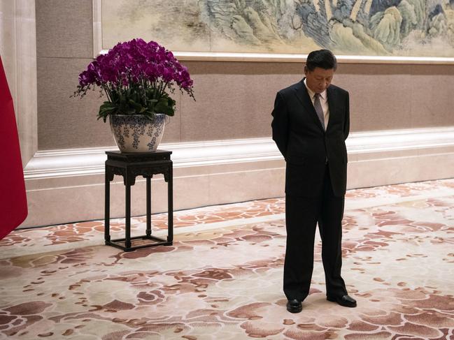 FILE - In this June 21, 2018, file photo, China's President Xi Jinping waits for the arrival of Papua New Guinea Prime Minister Peter O'Neill prior to a meeting at the Diaoyutai State Guesthouse in Beijing. Just months after clearing the way to rule in perpetuity president and ruling Communist Party leader Xi Jinping is best by a wave of economic, foreign policy and domestic political challenges. (Fred Dufour/Pool Photo via AP, File)