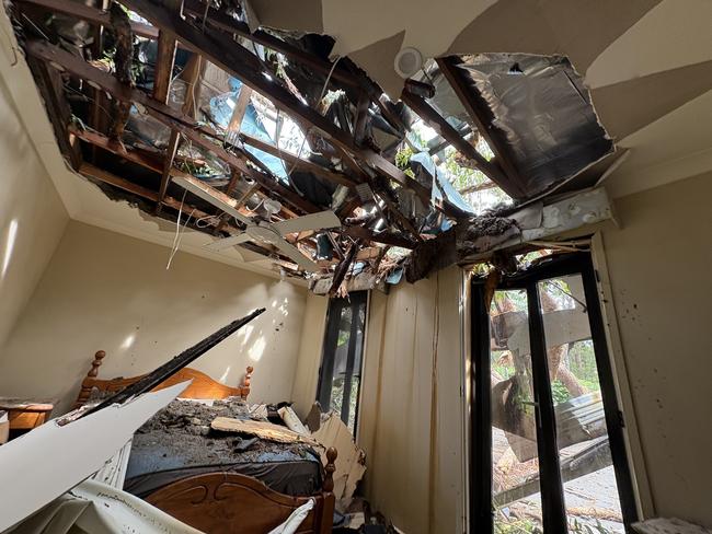 The damage inside Brooke Hanson’s childhood room where a guest miraculously avoided the destruction. Picture: Robert White.