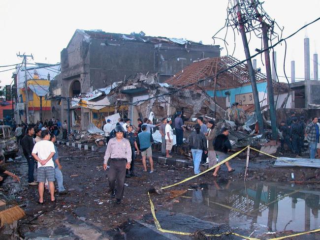 Police and onlookers at the site of the horror 2002 bomb blasts in Kuta. Picture: AFP
