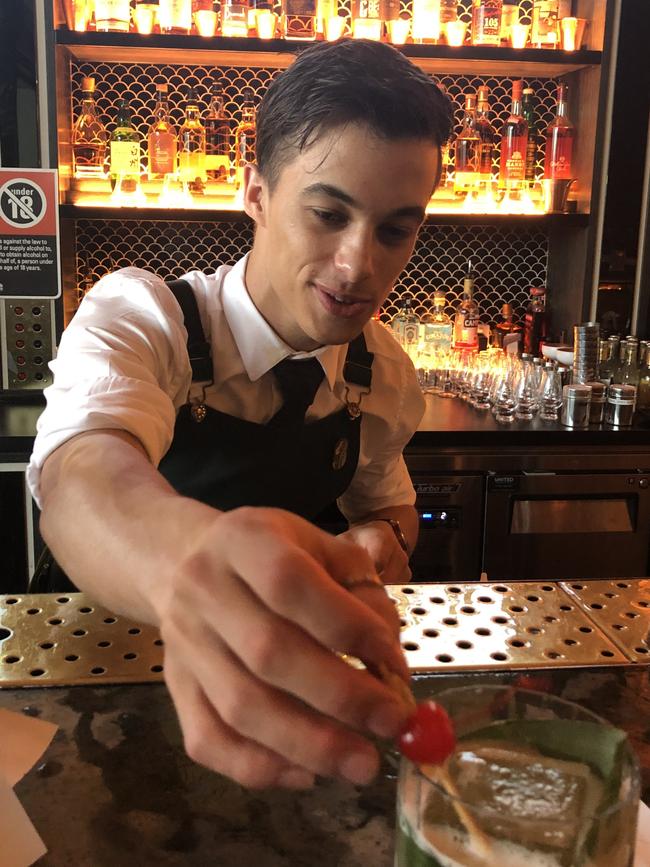 Jackson Poole garnishes a cocktail.