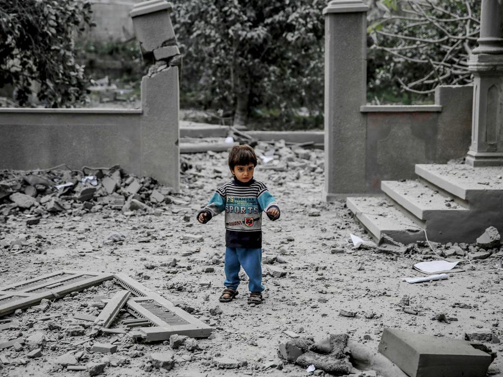 A Palestinian child walks amid the rubble of a house destroyed by Israeli bombardment in Gaza City. Picture: AFP