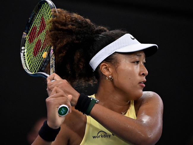 Japan's Naomi Osaka hits a return against Germany's Tamara Korpatsch during their women's singles match at the Brisbane International tennis tournament in Brisbane on January 1, 2024. (Photo by William WEST / AFP) / -- IMAGE RESTRICTED TO EDITORIAL USE - STRICTLY NO COMMERCIAL USE --