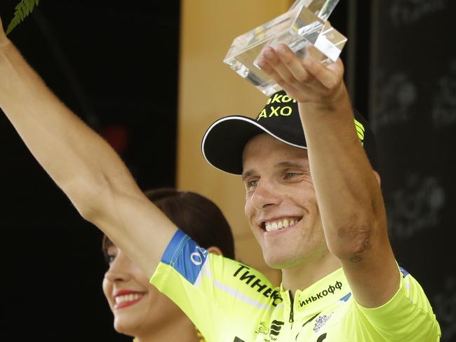 Stage winner Poland's Rafal Majka celebrates on the podium of the seventeenth stage of the Tour de France cycling race over 124.5 kilometers (77.4 miles) with start in Saint-Gaudens and finish in Saint-Lary, France, Wednesday, July 23, 2014. (AP Photo/Laurent Cipriani)