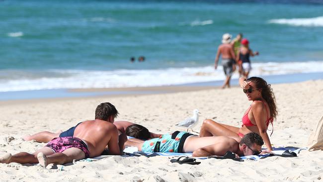 People hit the beach on the Gold Coast. Picture: Getty Images