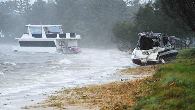 One of a number of boats washed ashore at Paradise Point, on the Gold Coast. Picture: Lyndon Mechielsen