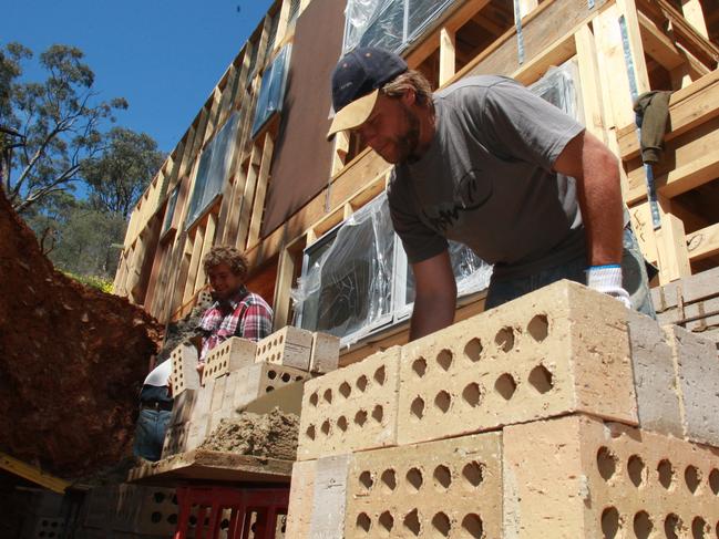 Bricklayer Luke Ryan, 29, of Fullarton, at work on a two story double brick house at Urrbrae.