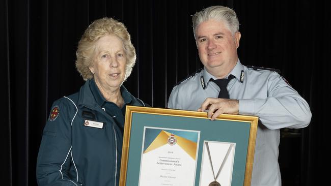 Queensland Ambulance Service Commissioner Craig Emery (right) presents Maxine Murray with the Volunteer of the Year, 2024. Photo: Renae Droop