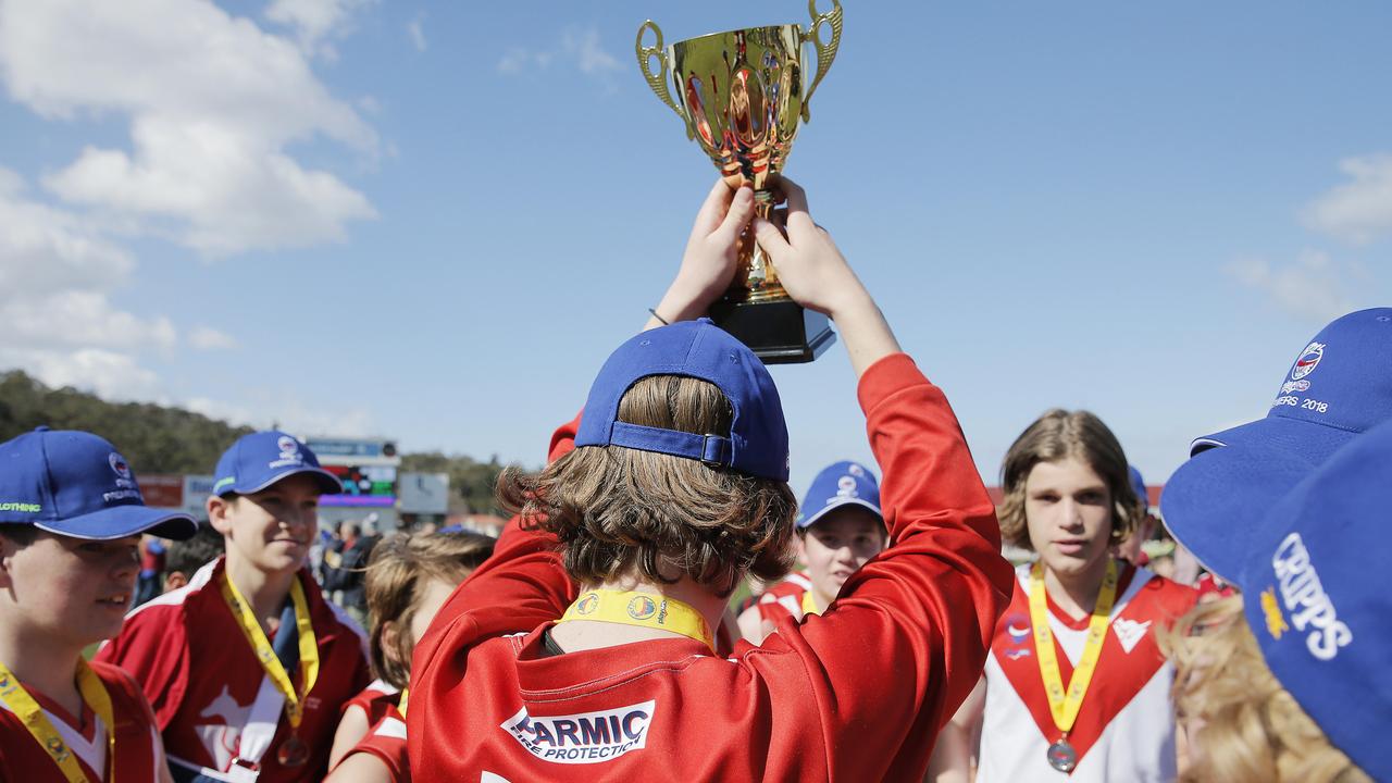 <p>Clarence under 14A boys Southern Tasmanian Junior Football League team with the premiership trophy in September, 2018. Picture: MATHEW FARRELL.</p>