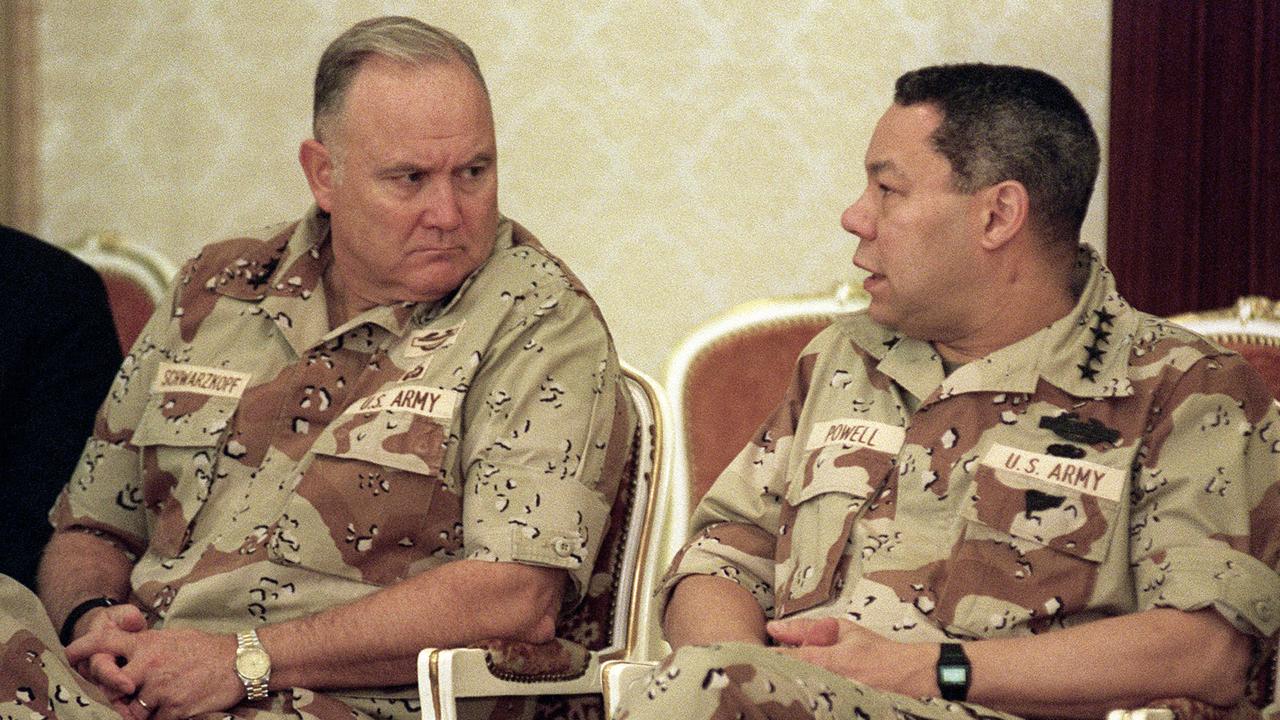 Former US Army General Norman Schwarzkopf (L), Commander of the US Forces in Saudi Arabia, talks with former US General Colin Powell, Chairman of the Joint Chiefs of Staff, in Dahran in 1990.