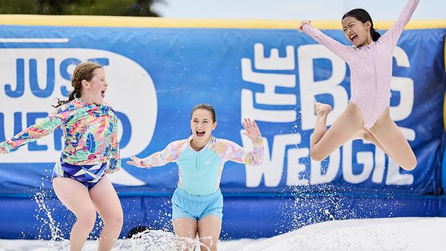 Friends Sophie Martin, 10, Adelaide Porter, 10, and Chloe Mu, 10 at The Big Wedgie Inflatable Water Park in West Beach. Picture: Matt Loxton