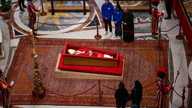 The body of Pope Francis lies in state inside St. Peterâs Basilica in The Vatican, on April 23, 2025. The Pope died of a stroke, the Vatican announced hours after the death on April 21, 2025, of the 88-year-old reformer who inspired devotion but riled traditionalists during 12 years leading the Catholic Church. (Photo by Tiziana FABI / AFP)
