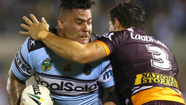 Sharks prop Andrew Fifita charges at Broncos centre James Roberts. Picture: Gregg Porteous