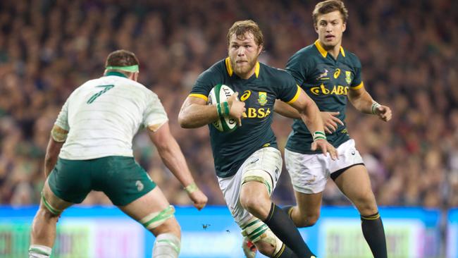 Duane Vermeulen of South Africa runs at Rhys Ruddock of Ireland.