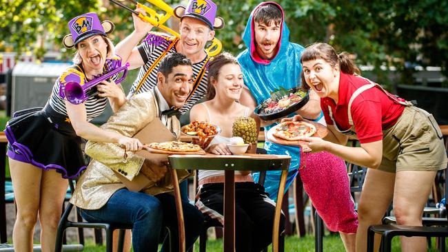 Fringe-goer Lucy Bowden, centre, with performers Dr Ahmed Kazmi (from Cabaret Consultations) at the table and, from left, April Dawson and Kyle Raftery (Brass Monkeys), Richard Sullivan (Werk It) and Shona Conacher (Don’t Mess With the Dummies) at the Garden of Unearthly Delights. Picture: Matt Turner