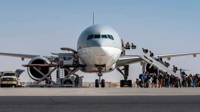 US Embassy personnel from Afghanistan board a flight to Kuwait as part of Operation Allies Refuge. Picture: AFP.