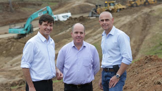 Hume Federal MP Angus Taylor, Dart West general manager David Taylor and Camden State MP Chris Patterson at the site of Gregory Hills Drive. Picture: Timothy Clapin.