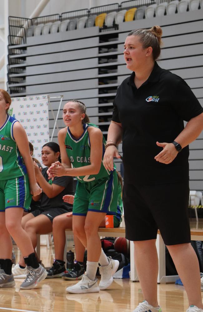 Gold Coast coach Cassie Dover and their bench celebrate during their semi-final win.