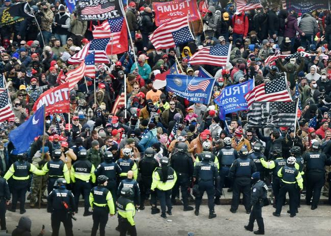 Trump supporters clash with police as they storm the US Capitol in Washington on January 6, 2021