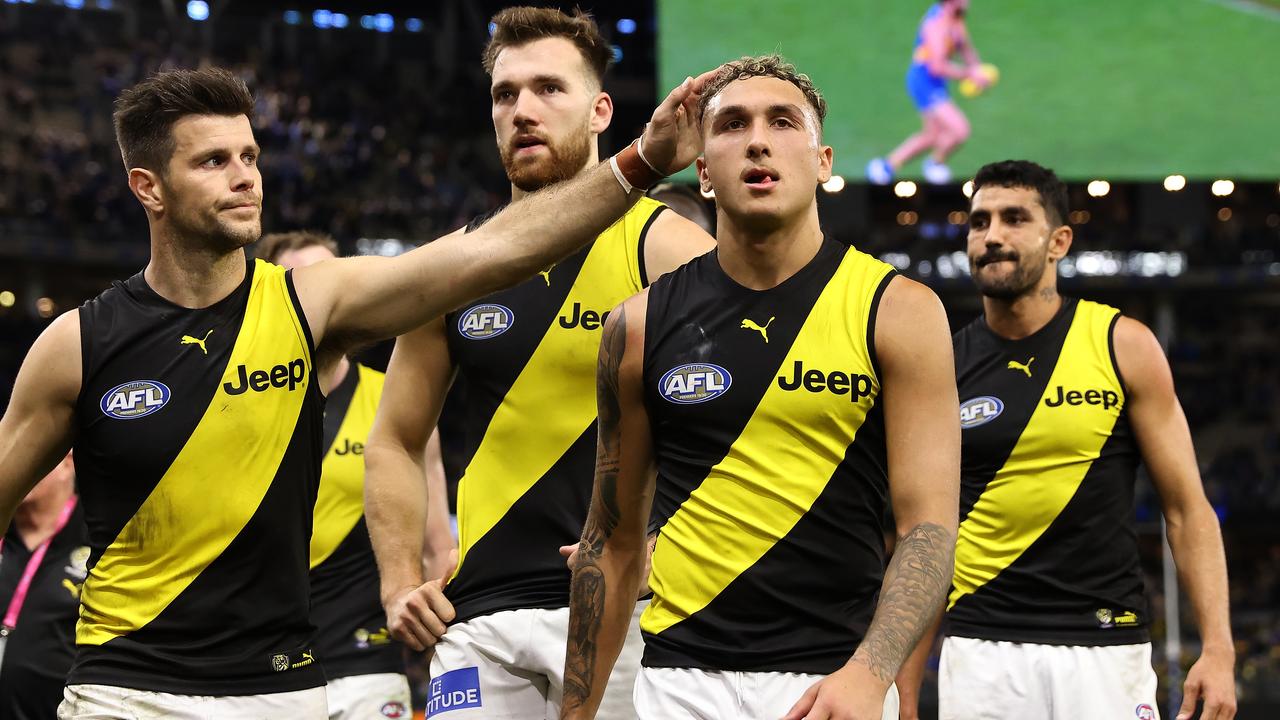 PERTH, AUSTRALIA - JUNE 13: Trent Cotchin of the Tigers consoles Shai Bolton while walking from the field after being defeated during the round 14 AFL match between the West Coast Eagles and the Richmond Tigers at Optus Stadium on June 13, 2021 in Perth, Australia. (Photo by Paul Kane/Getty Images)