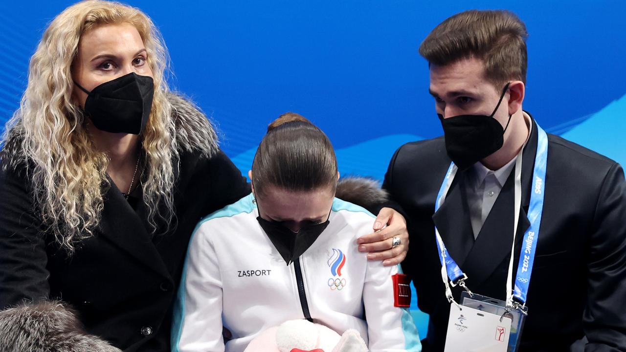 Kamila Valieva with choreographer Daniil Gleikhengauz (R) and coach Eteri Tutberidze (L).