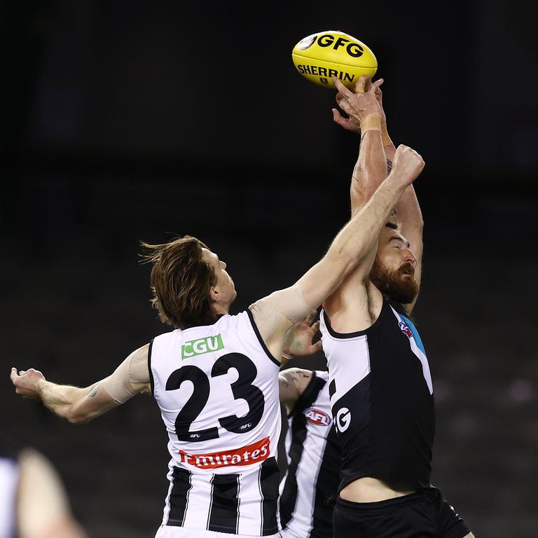 Jordan Roughead spoils an attempted mark by Charlie Dixon. Picture: Michael Klein