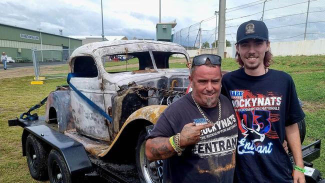 Kadin Berry, 18 and a mate at the Rockhampton Showgrounds, in front of the burnt-out shell of his vehicle.