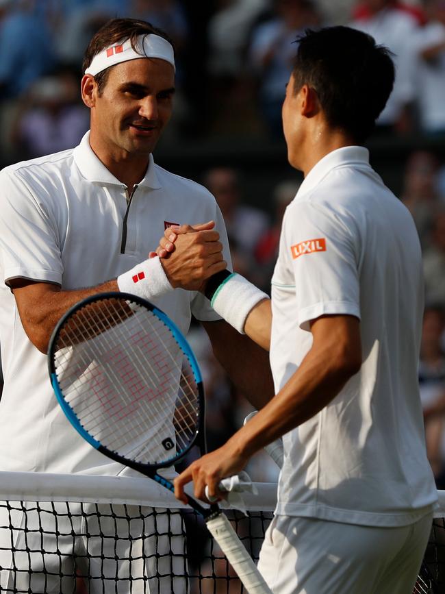 Federer shakes hands with Kei Nishikori. Picture: AFP