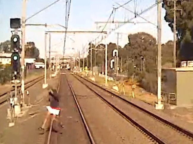 A male runs in front of a moving train near Warrick Farm. Picture: Supplied