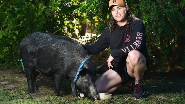 Daniel English with his pet Razerback pig, Missy. Picture: Shae Beplate.