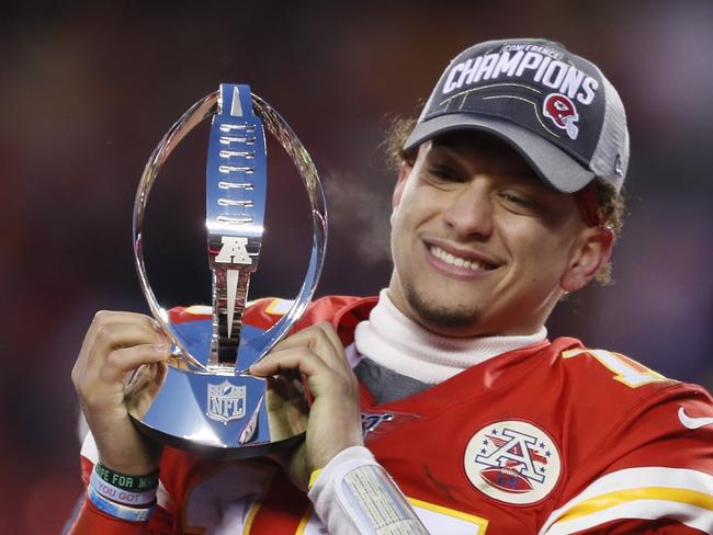 Kansas City Chiefs' Patrick Mahomes celebrates with the Lamar Hunt Trophy after the NFL AFC Championship football game against the Tennessee Titans Sunday, Jan. 19, 2020, in Kansas City, MO. The Chiefs won 35-24 to advance to Super Bowl 54. (AP Photo/Charlie Neibergall)