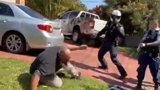 Screen grabs of the Tik Tok videoshowing the man falling to the ground after being struck as other officers arrive.
