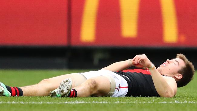 Zach Merrett is groggy on the field after a high hit from Levi Greenwood. Picture: Getty Images