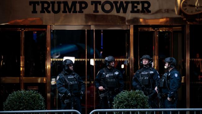 New York’s finest stand guard outside Trump Tower in New York.