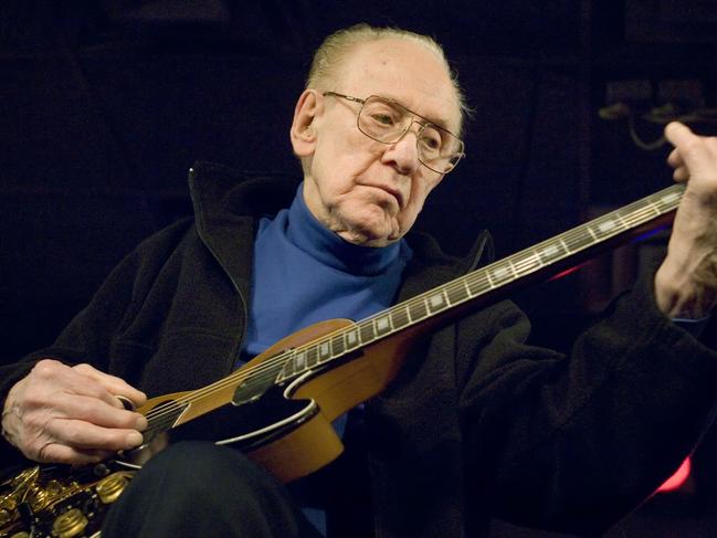 FILE - In this Feb. 26, 2007 file photo, Guitar legend Les Paul performs at the Iridium Jazz Club in New York.A yearlong celebration marking guitarist Les Paul’s 100th birthday kicks off in Times Square in New York on June 9, 2015. (AP Photo/ Colin Archer, file)