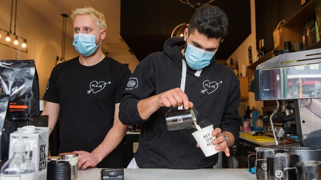 Adam Zeineddine, right, owner of My Oh My cafe and barista Andy Balloch adopted the use of masks early. Picture: Paul Jeffers