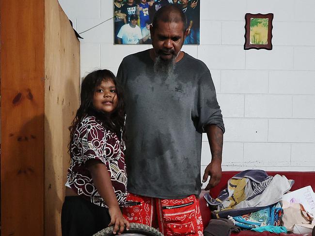 A monsoonal tropical low pressure system has brought devastating widespread flooding to North Queensland and parts of Cardwell in Far North Queensland,Bill Dunrobin and his six year old daughter Daisy Dunrobin moved from Brisbane to Cardwell one year ago with two bags of clothes. After building up their lives in their new home, all of their possessions were lost in a few hours on Sunday night after flood waters rushed through their Roma Street property. Picture: Brendan Radke