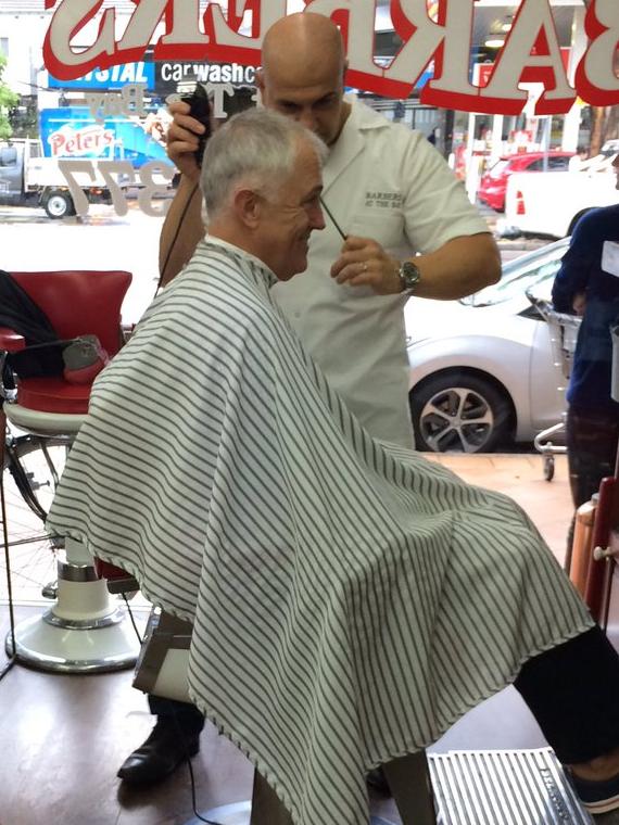 Prime Minister Malcolm Turnbull gets a trim at his barber this morning. Picture: Twitter/Sam Chadwick