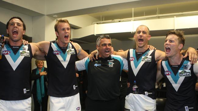 Coach Mark Williams (centre) with Troy Chaplin, Dean Brogan, Warren Tredrea and Jason Davenport celebrating after Showdown 28.