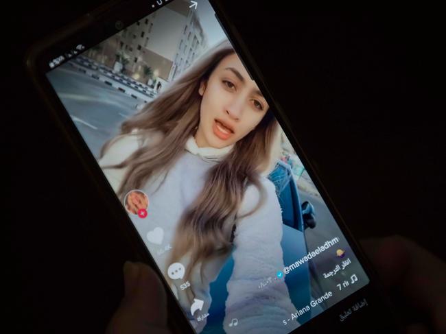 A woman watches a video of influencer Mowada al-Adham, who was sentenced to two years in jail on charges of violation public morals, on TikTok in Egypt's capital Cairo. Picture: AFP